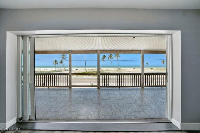 5557 Estero Blvd, Fort Myers Beach, FL 33931 - unfurnished sunroom featuring view of water and beach