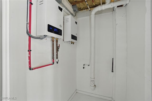 5557 Estero Blvd, Fort Myers Beach, FL 33931 - utility room with tankless water heater