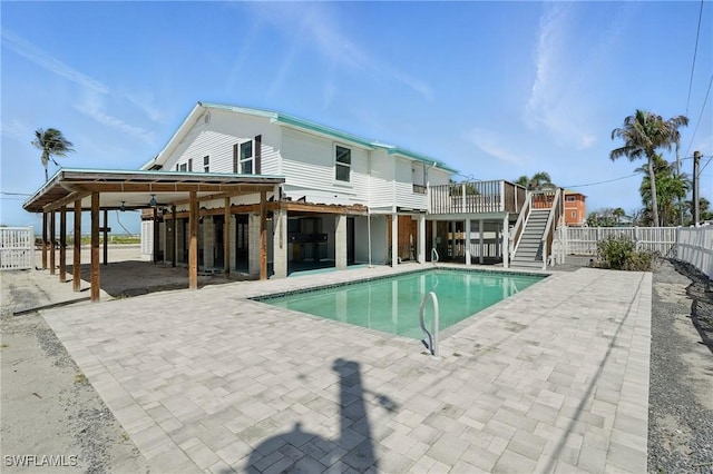 5557 Estero Blvd, Fort Myers Beach, FL 33931 - view of pool with stairs, a patio, and a wooden deck