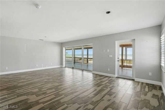 5557 Estero Blvd, Fort Myers Beach, FL 33931 - unfurnished room with a smoke detector and wood finish floors