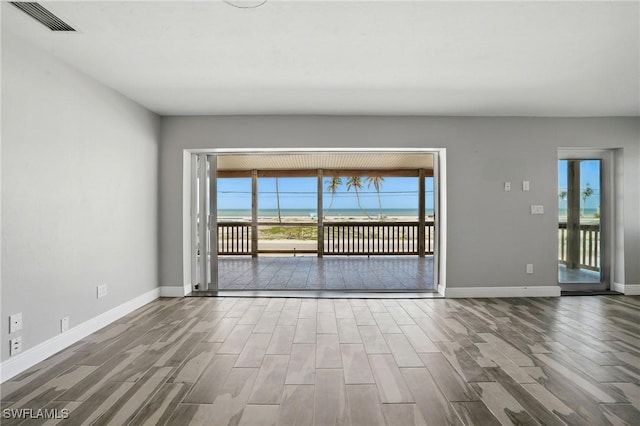 5557 Estero Blvd, Fort Myers Beach, FL 33931 - spare room with wood finished floors