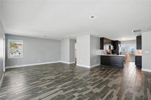 5557 Estero Blvd, Fort Myers Beach, FL 33931 - unfurnished living room with baseboards and wood tiled floors