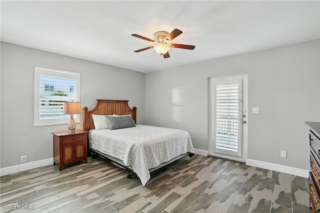 5557 Estero Blvd, Fort Myers Beach, FL 33931 - bedroom with wood finish floors, ceiling fan, and access to exterior