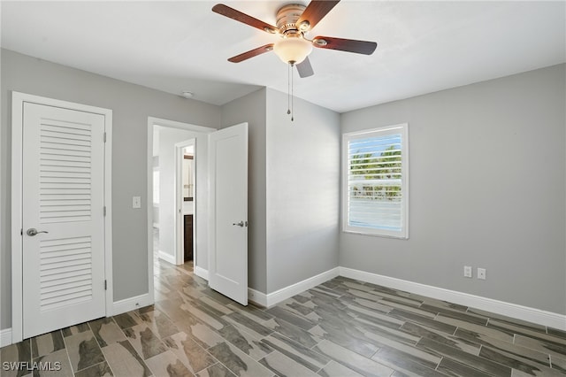 5557 Estero Blvd, Fort Myers Beach, FL 33931 - unfurnished bedroom featuring wood finish floors and ceiling fan