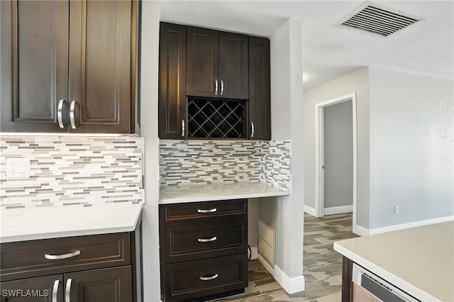 5557 Estero Blvd, Fort Myers Beach, FL 33931 - kitchen featuring light countertops and dark brown cabinetry