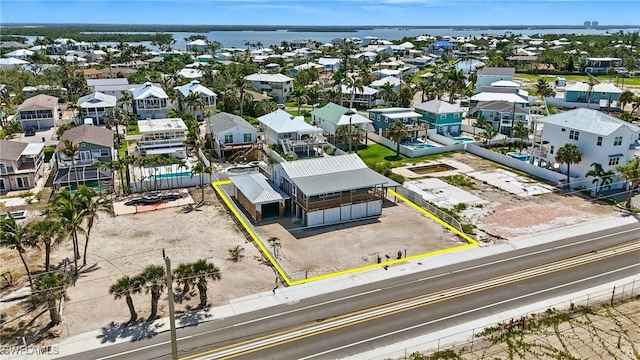 5557 Estero Blvd, Fort Myers Beach, FL 33931 - aerial perspective of suburban area with property boundaries highlighted and a nearby body of water