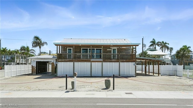 5557 Estero Blvd, Fort Myers Beach, FL 33931 - coastal home featuring a metal roof
