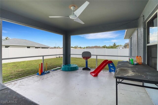 3211 NE 14th Pl, Cape Coral, FL 33909 - fenced backyard featuring a ceiling fan and a patio area