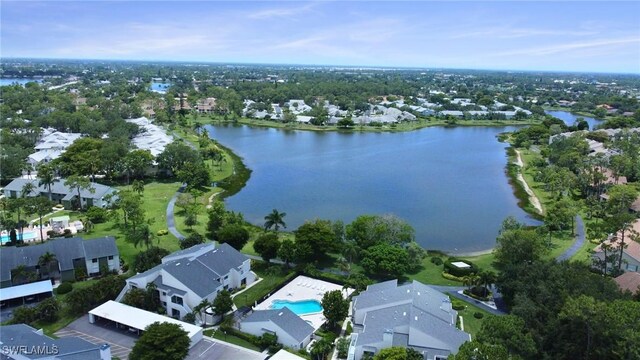 3052 Kings Lake Blvd Unit 7554, Naples, FL 34112 - aerial perspective of suburban area featuring a nearby body of water and a pool area