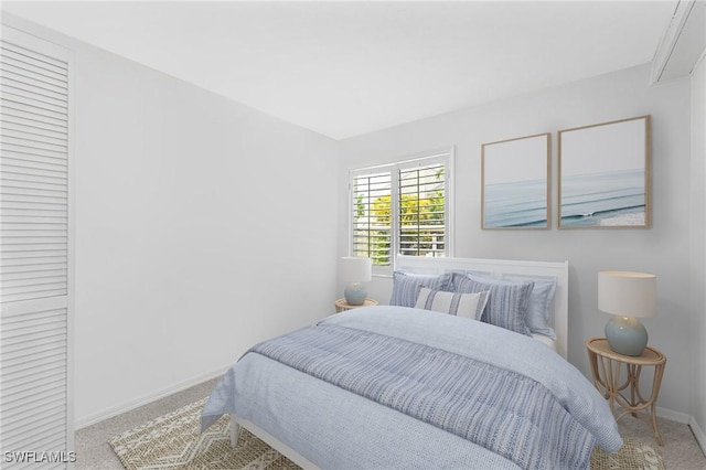 3052 Kings Lake Blvd Unit 7554, Naples, FL 34112 - carpeted bedroom with baseboards