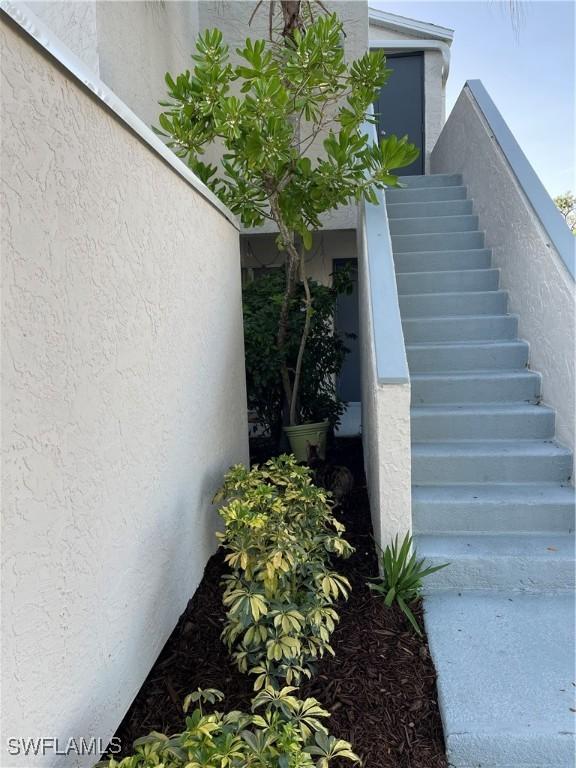 3052 Kings Lake Blvd Unit 7554, Naples, FL 34112 - view of staircase