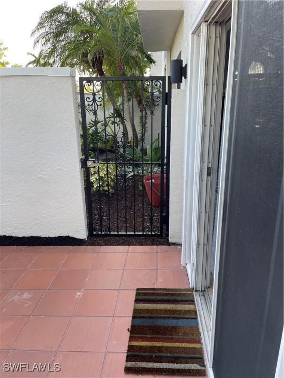 3052 Kings Lake Blvd Unit 7554, Naples, FL 34112 - view of gate