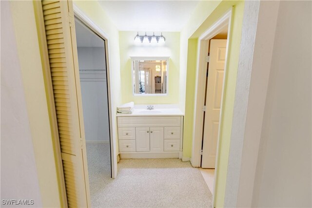 3052 Kings Lake Blvd Unit 7554, Naples, FL 34112 - hallway with light colored carpet