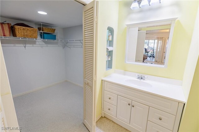 3052 Kings Lake Blvd Unit 7554, Naples, FL 34112 - bathroom featuring vanity and recessed lighting