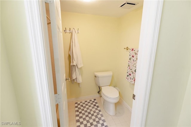3052 Kings Lake Blvd Unit 7554, Naples, FL 34112 - bathroom with toilet and baseboards