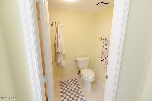 3052 Kings Lake Blvd Unit 7554, Naples, FL 34112 - bathroom featuring toilet and baseboards