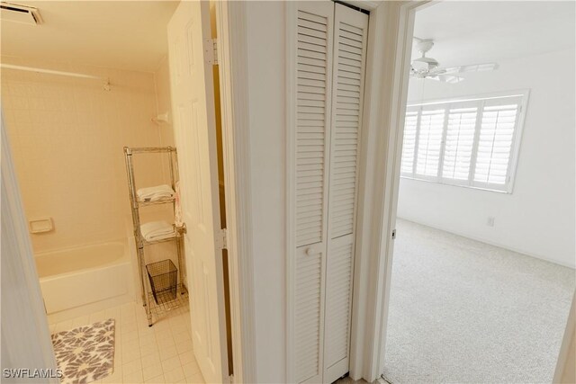 3052 Kings Lake Blvd Unit 7554, Naples, FL 34112 - corridor with tile patterned flooring