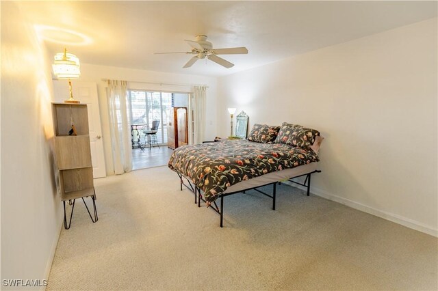 3052 Kings Lake Blvd Unit 7554, Naples, FL 34112 - carpeted bedroom with baseboards and a ceiling fan