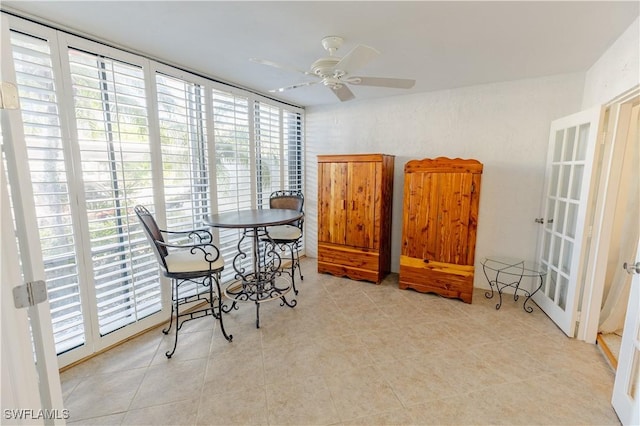 3052 Kings Lake Blvd Unit 7554, Naples, FL 34112 - dining room with ceiling fan and light tile patterned floors