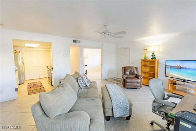 3052 Kings Lake Blvd Unit 7554, Naples, FL 34112 - living room featuring light tile patterned floors and a ceiling fan