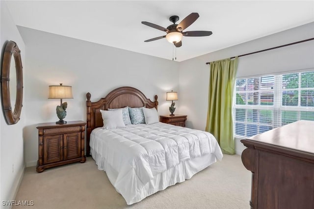 8565 Via Garibaldi Cir Unit 104, Estero, FL 33928 - bedroom with light carpet and ceiling fan