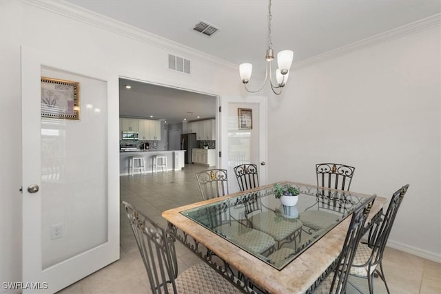 8959 Cascade Price Cir, North Fort Myers, FL 33917 - dining space with ornamental molding, a chandelier, and light tile patterned floors