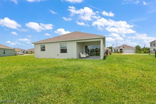 8959 Cascade Price Cir, North Fort Myers, FL 33917 - back of property featuring stucco siding and a lawn