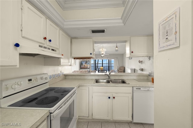 1901 Clifford St Unit 202, Fort Myers, FL 33901 - kitchen with white appliances, under cabinet range hood, light countertops, light tile patterned flooring, and ornamental molding