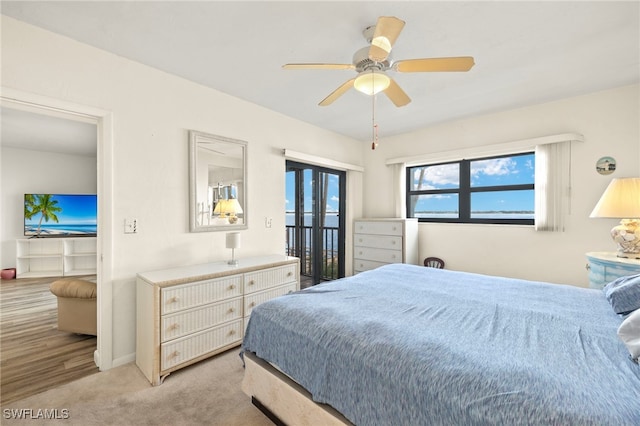 1901 Clifford St Unit 202, Fort Myers, FL 33901 - bedroom with access to exterior, light colored carpet, and ceiling fan