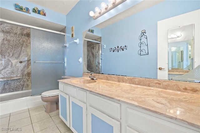 1901 Clifford St Unit 202, Fort Myers, FL 33901 - full bathroom featuring a shower with door, tile patterned flooring, and vanity