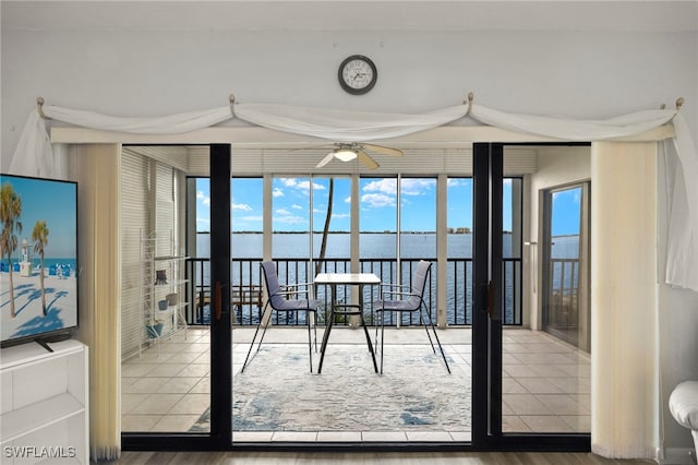 1901 Clifford St Unit 202, Fort Myers, FL 33901 - dining area featuring healthy amount of natural light, a ceiling fan, wood finished floors, and a water view