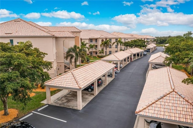9190 Southmont Cv Unit 306, Fort Myers, FL 33908 - view of home's community with covered and uncovered parking and a residential view