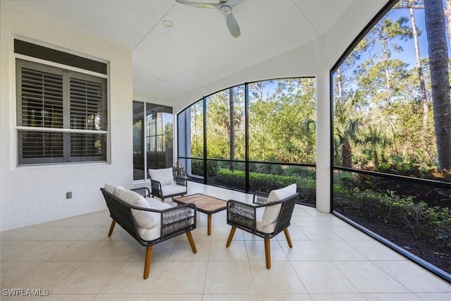 29120 Brendisi Way Unit 102, Naples, FL 34110 - sunroom with ceiling fan, a textured wall, an outdoor living space, lofted ceiling, and tile patterned flooring