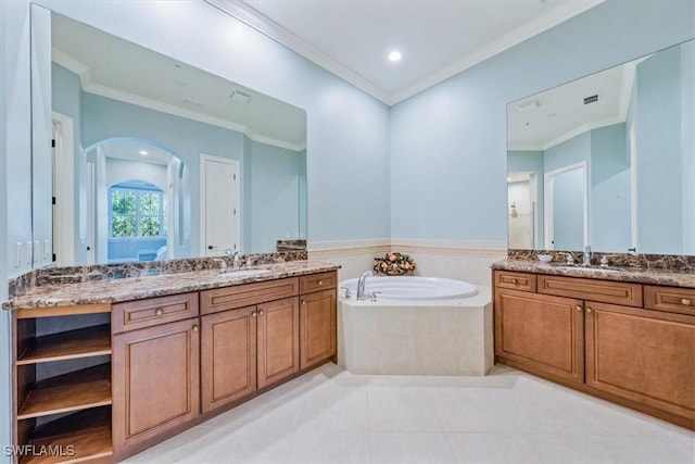 29120 Brendisi Way Unit 102, Naples, FL 34110 - bathroom with crown molding, a garden tub, two vanities, tile patterned floors, and recessed lighting