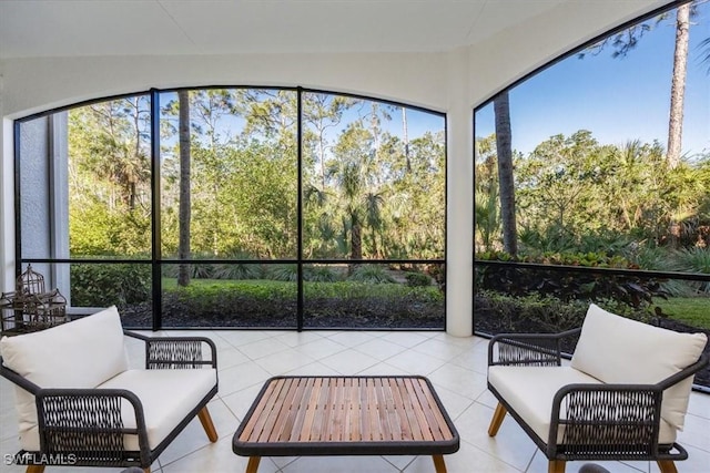 29120 Brendisi Way Unit 102, Naples, FL 34110 - sunroom with an outdoor hangout area and tile patterned flooring
