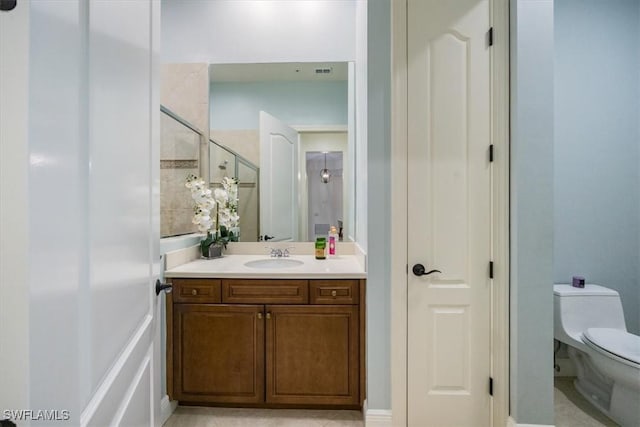 29120 Brendisi Way Unit 102, Naples, FL 34110 - bathroom featuring vanity, a tile shower, and a closet