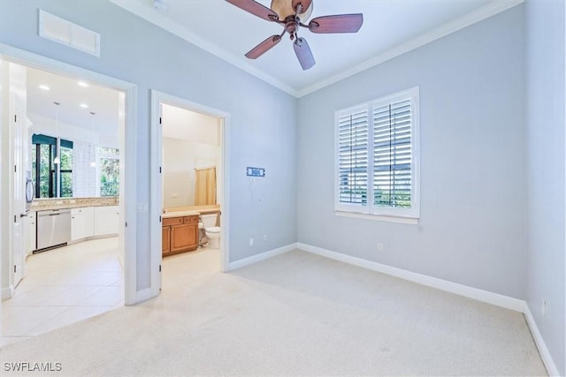 29120 Brendisi Way Unit 102, Naples, FL 34110 - unfurnished bedroom featuring ensuite bath, multiple windows, light colored carpet, and crown molding