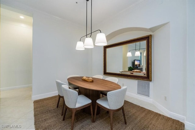 29120 Brendisi Way Unit 102, Naples, FL 34110 - dining space featuring ornamental molding and light tile patterned flooring