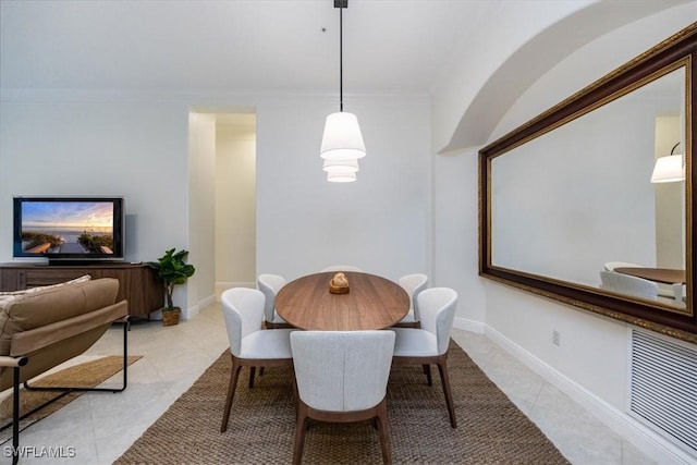 29120 Brendisi Way Unit 102, Naples, FL 34110 - dining area with light tile patterned flooring and crown molding