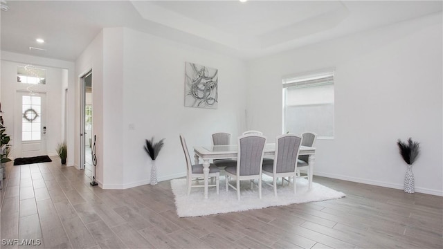15898 Sugar Hill Dr, Punta Gorda, FL 33982 - dining space with wood finished floors, recessed lighting, and a raised ceiling