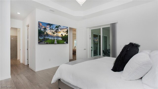 15898 Sugar Hill Dr, Punta Gorda, FL 33982 - bedroom featuring light wood-style flooring and access to outside
