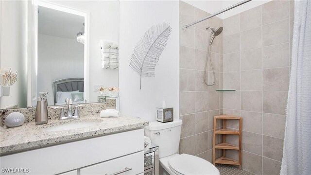 15898 Sugar Hill Dr, Punta Gorda, FL 33982 - ensuite bathroom with vanity, tiled shower, and tile patterned floors