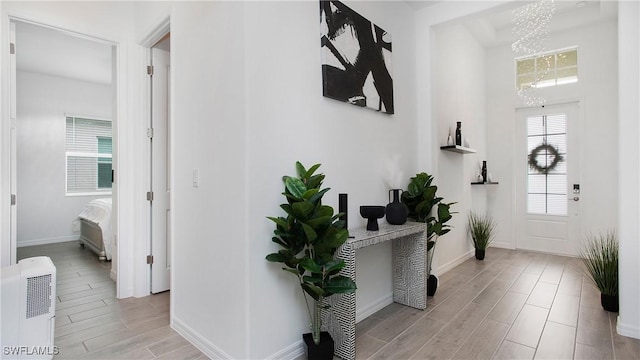15898 Sugar Hill Dr, Punta Gorda, FL 33982 - entryway with a chandelier and wood tiled floors