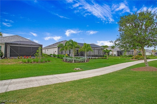 15898 Sugar Hill Dr, Punta Gorda, FL 33982 - view of front of property featuring a front lawn, a residential view, and a lanai