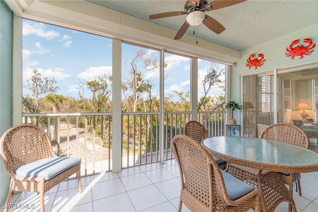 22724 Island Pines Way Unit 101, Fort Myers Beach, FL 33931 - sunroom featuring ceiling fan and outdoor dining area