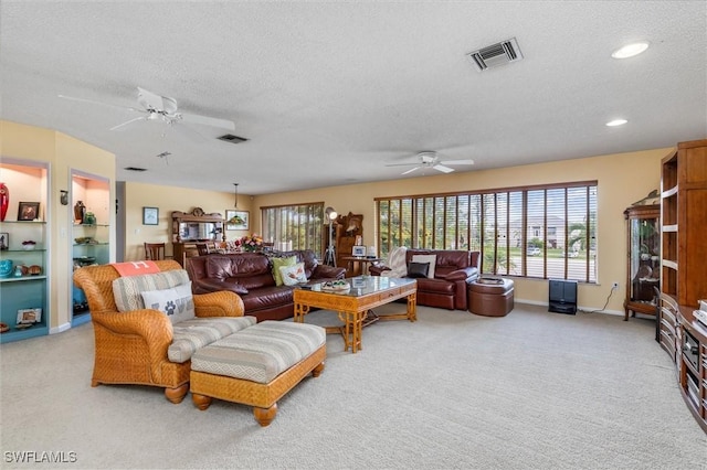 24398 Treasure Island Blvd, Punta Gorda, FL 33955 - living room with ceiling fan, a textured ceiling, light colored carpet, and recessed lighting