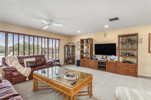 24398 Treasure Island Blvd, Punta Gorda, FL 33955 - living area with plenty of natural light, carpet floors, a textured ceiling, a ceiling fan, and recessed lighting