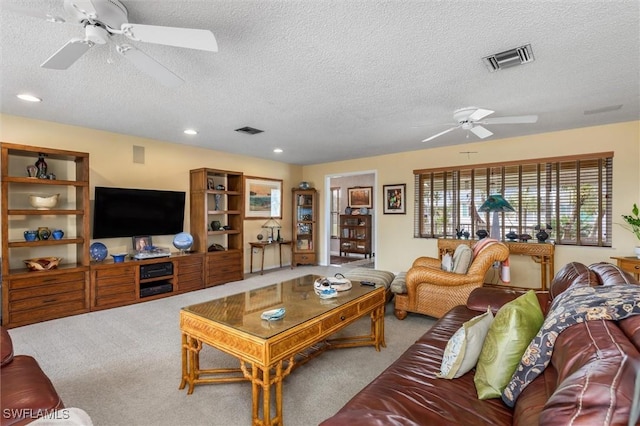 24398 Treasure Island Blvd, Punta Gorda, FL 33955 - carpeted living area with a ceiling fan, a textured ceiling, and recessed lighting