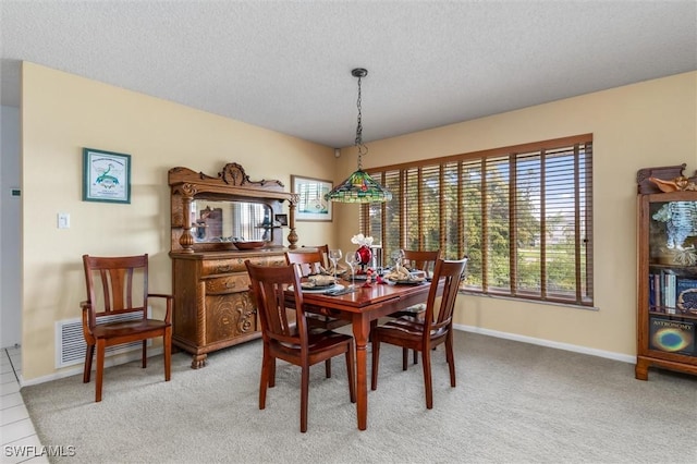 24398 Treasure Island Blvd, Punta Gorda, FL 33955 - dining area with light colored carpet and a textured ceiling