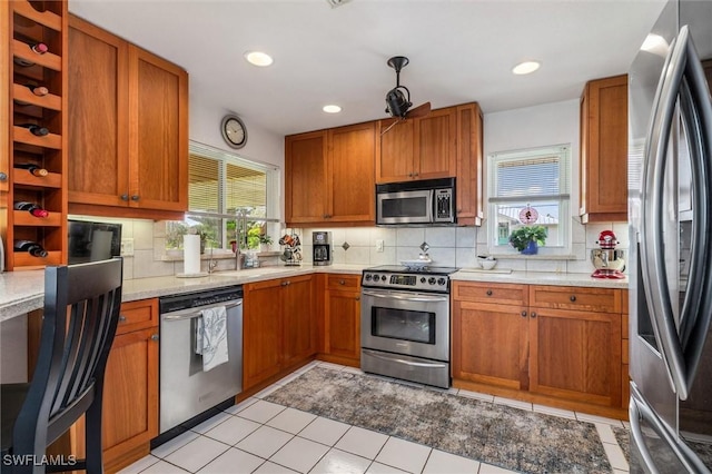 24398 Treasure Island Blvd, Punta Gorda, FL 33955 - kitchen with stainless steel appliances, decorative backsplash, brown cabinetry, open shelves, and recessed lighting